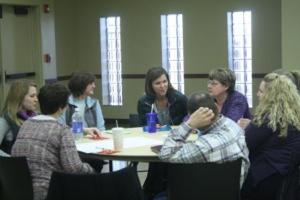 Team members from Iowa, Tama, & Poweshiek counties discuss ties to their communities.
