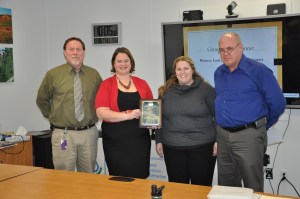  Iowa County WLL team representatives accept the 2015 Group Civil Rights award from the joint USDA Civil Rights Committee. From left to right: NRCS Assistant State Conservationist for Management and Strategy Jon Hubbert, NRCS District Conservationist Katherine Timmerman, IDALS State Secretary Leslie Maxwell and NRCS Assistant State Conservationist for Field Operations Kevin McCall.